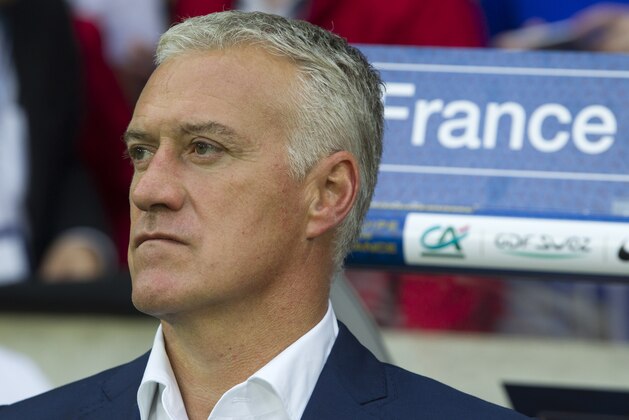 French head soccer coach Didier Deschamps waits as the Fans cheer on the United States team at the friendly soccer match between France and Jamaica at the Lille Metropole stadium, in Villeneuve d'Ascq, northern France, Sunday, June 8, 2014.  France soccer team is preparing for the upcoming FIFA soccer World Cup in Brazil starting on 12 June. (AP Photo/Jacques Brinon)