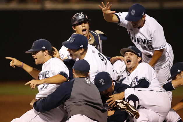 UC Irvine players celebrate following an NCAA college baseball tournament super regional game against Oklahoma State in Stillwater, Okla., Saturday, June 7, 2014. UC Irvine won 1-0 to move on to the College World Series in Omaha. (AP Photo/Sue Ogrocki)