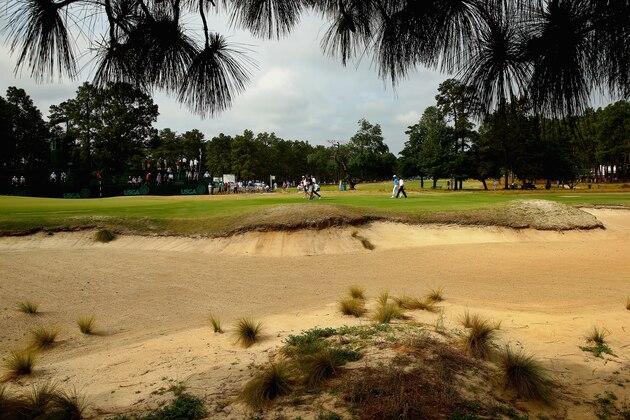 PINEHURST, NC - JUNE 09:  Bubba Watson of the United States, Aaron Baddeley of Australia and David Gossett of the United States walk across the 14th green during a practice round prior to the start of the 114th U.S. Open at Pinehurst Resort & Country Club, Course No. 2 on June 9, 2014 in Pinehurst, North Carolina.  (Photo by Streeter Lecka/Getty Images)