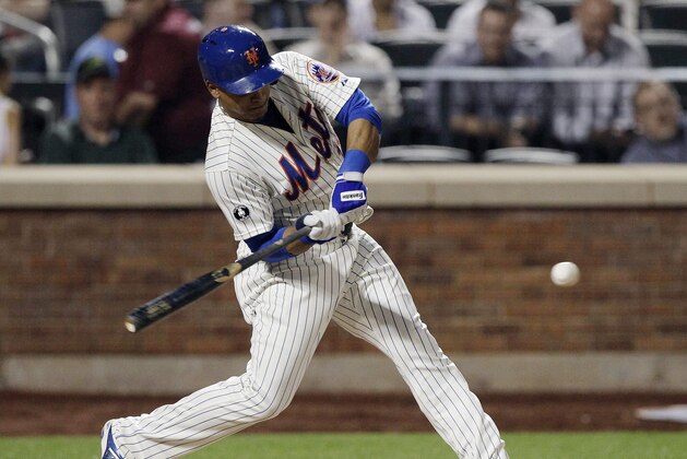 New York Mets' Juan Lagares hits an RBI double during the fourth inning of a baseball game against the Pittsburgh Pirates on Tuesday, May 27, 2014, in New York.  (AP Photo/Frank Franklin II)