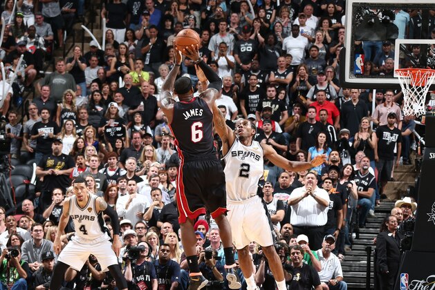 SAN ANTONIO, TX - JUNE 8: LeBron James #6 of the Miami Heat shoots against Kawhi Leonard #2 of the San Antonio Spurs in Game Two of the 2014 NBA Finals at AT&T Center on June 5, 2014 in San Antonio, Texas. NOTE TO USER: User expressly acknowledges and agrees that, by downloading and/or using this photograph, user is consenting to the terms and conditions of the Getty Images License Agreement.  Mandatory Copyright Notice: Copyright 2014 NBAE (Photo by Nathaniel S. Butler/NBAE via Getty Images)
