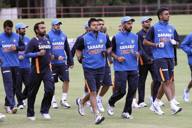 Indian Cricket players are seen during a practice session in Harare, Monday, July, 22, 2013. India and Zimbabwe will play a one day cricket match Wednesday.  (AP Photo/Tsvangirayi Mukwazhi)