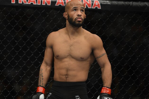 December 14, 2013; Sacramento, CA, USA; Demetrious Johnson (red gloves) fights Joseph Benavidez (blue gloves) during the flyweight championship bout of the UFC on FOX 9 at Sleep Train Arena. Johnson defeated Benavidez. Mandatory Credit: Kyle Terada-USA TODAY Sports