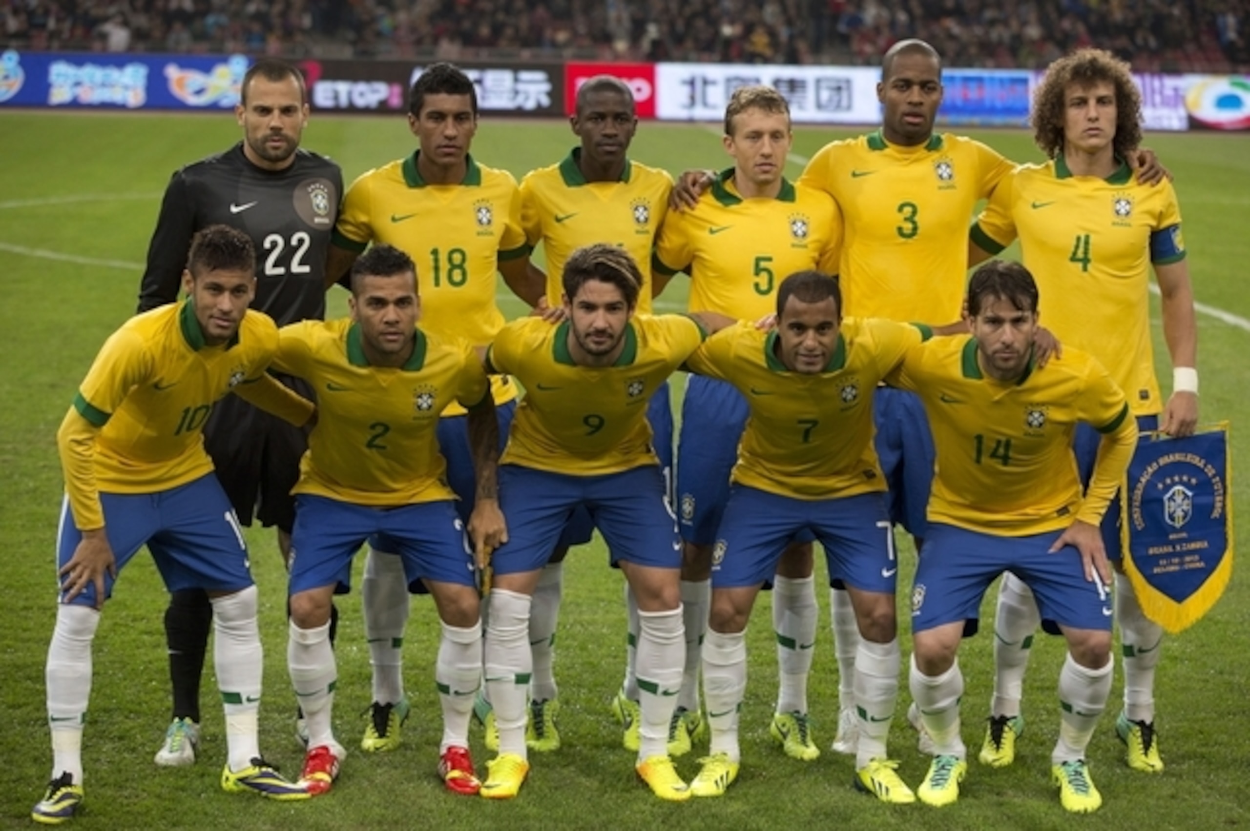 FILE - In this Oct. 15, 2013 file photo, Brazil soccer team poses prior to the start their  international friendly soccer match against Zambia at the Bird's Nest national stadium in Beijing, China. Background from left: Diego Cavalier, Paulinho, Ramires, Lucas, Anderson Dede, and David Luiz. Foreground from left: Neymar, Dani Alves, Alexandre Pato, Lucas Moura and Maxwell. (AP Photo/Ng Han Guan, File)- SEE FURTHER WORLD CUP CONTENT AT APIMAGES.COM