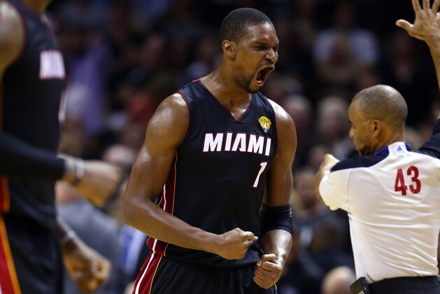 SAN ANTONIO, TX - JUNE 08:  Chris Bosh #1 of the Miami Heat reacts against the San Antonio Spurs during Game Two of the 2014 NBA Finals at the AT&T Center on June 8, 2014 in San Antonio, Texas. The Miami Heat defeated the San Antonio Spurs 98-96. NOTE TO USER: User expressly acknowledges and agrees that, by downloading and or using this photograph, User is consenting to the terms and conditions of the Getty Images License Agreement.  (Photo by Andy Lyons/Getty Images)