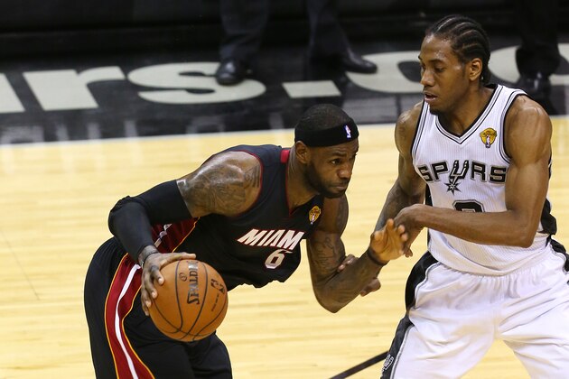 SAN ANTONIO, TX - JUNE 8:  LeBron James #6 of the Miami Heat drives around Kawhi Leonard #2 of the San Antonio Spurs in Game Two of the 2014 NBA Finals at the AT&T Center on June 8, 2014 in San Antonio, Texas. NOTE TO USER: User expressly acknowledges and agrees that, by downloading and/or using this photograph, user is consenting to the terms and conditions of the Getty Images License Agreement. (Photo by Chris Covatta/Getty Images)