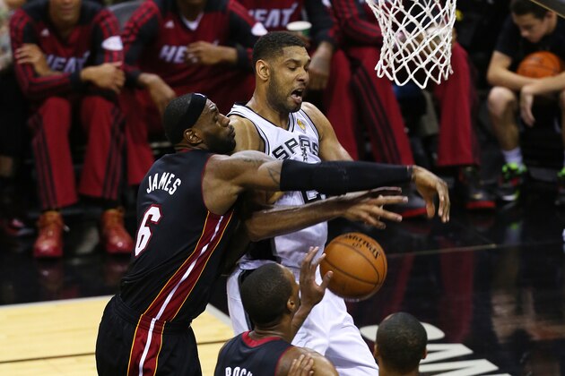 SAN ANTONIO, TX - JUNE 8: LeBron James #6 of the Miami Heat fouls Tim Duncan #21 of the San Antonio Spurs in Game Two of the 2014 NBA Finals at the AT&T Center on June 8, 2014 in San Antonio, Texas. NOTE TO USER: User expressly acknowledges and agrees that, by downloading and/or using this photograph, user is consenting to the terms and conditions of the Getty Images License Agreement. (Photo by Chris Covatta/Getty Images) SAN ANTONIO, TX - JUNE 8: LeBron James #6 of the Miami Heat fouls Tim Duncan #21 of the San Antonio Spurs in Game Two of the 2014 NBA Finals at the AT&T Center on June 8, 2014 in San Antonio, Texas. NOTE TO USER: User expressly acknowledges and agrees that, by downloading and/or using this photograph, user is consenting to the terms and conditions of the Getty Images License Agreement. (Photo by Chris Covatta/Getty Images)