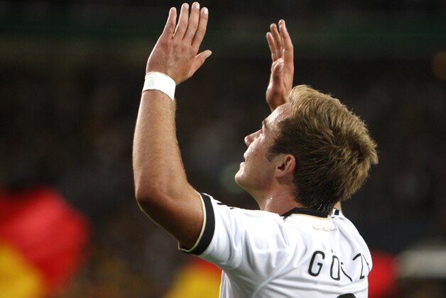 Germany's Mario Goetze celebrates his team's 2nd goal during a soccer friendly match between Germany and Brazil in Stuttgart, Germany, Wednesday, Aug.10, 2011.(AP Photo/Michael Probst)