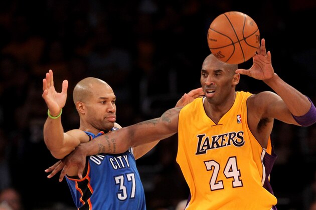 LOS ANGELES, CA - MAY 18:  Kobe Bryant #24 of the Los Angeles Lakers catches a pass as he fends off Derek Fisher #37 of the Oklahoma City Thunder in Game Three of the Western Conference Semifinals in the 2012 NBA Playoffs on May at Staples Center on May 18, 2012 in Los Angeles, California. The Lakers won 99-96.  NOTE TO USER: User expressly acknowledges and agrees that, by downloading and or using this photograph, User is consenting to the terms and conditions of the Getty Images License Agreement.  (Photo by Stephen Dunn/Getty Images)