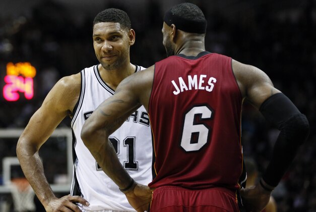 Jun 5, 2014; San Antonio, TX, USA; San Antonio Spurs forward Tim Duncan (21) talks to Miami Heat forward LeBron James (6) during the second quarter in game one of the 2014 NBA Finals at AT&T Center. Mandatory Credit: Soobum Im-USA TODAY Sports