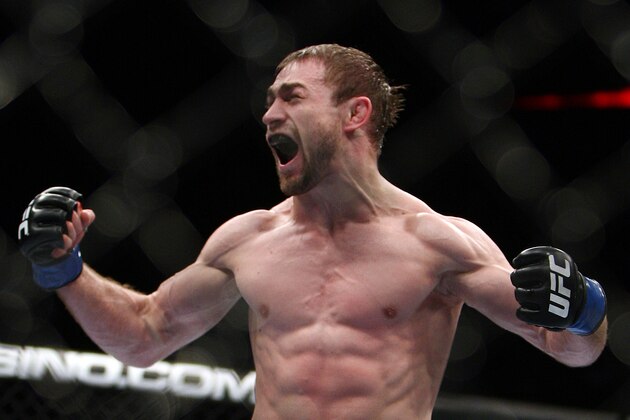 Ali Bagautinov, of Russia, reacts after defeating John Lineker, of Brazil, during the third round of a UFC 169 flyweight mixed martial arts bout in Newark, N.J., Saturday, Feb. 1, 2014. Bagautinov won by unanimous decision. (AP Photo/Tim Larsen)