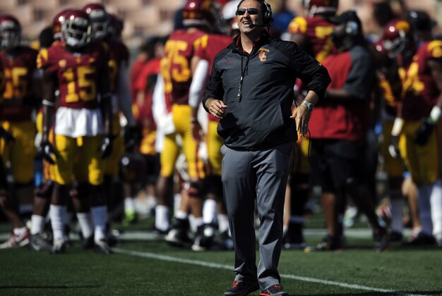 Apr 19, 2014; Los Angeles, CA, USA; Southern California head coach Steve Sarkisian (center) looks up during the Southern California Spring Game at Los Angeles Memorial Coliseum. Mandatory Credit: Kelvin Kuo-USA TODAY Sports