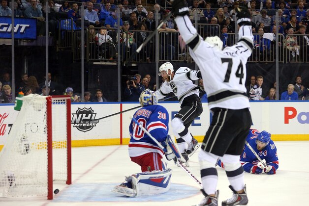 Jun 9, 2014; New York, NY, USA; Los Angeles Kings center Jeff Carter (77) celebrates with left wing Dwight King (74) after scoring a goal past New York Rangers goalie Henrik Lundqvist (30) during the first period in game three of the 2014 Stanley Cup Final at Madison Square Garden. Mandatory Credit: Brad Penner-USA TODAY Sports