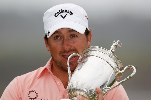 PEBBLE BEACH, CA - JUNE 20:  Graeme McDowell of Northern Ireland celebrates with the trophy on the 18th green after winning the 110th U.S. Open at Pebble Beach Golf Links on June 20, 2010 in Pebble Beach, California.  (Photo by Donald Miralle/Getty Images)