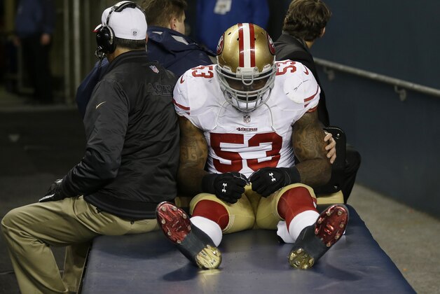San Francisco 49ers' NaVorro Bowman is taken to the locker room on a cart after injuring his leg during the second half of the NFL football NFC Championship game against the Seattle Seahawks, Sunday, Jan. 19, 2014, in Seattle. (AP Photo/Marcio Jose Sanchez)