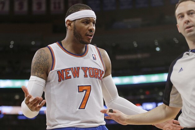 New York Knicks' Carmelo Anthony (7) argues a call during the second half of an NBA basketball game against the Brooklyn Nets Wednesday, April 2, 2014, in New York. The Knicks won the game 110-81. (AP Photo/Frank Franklin II)