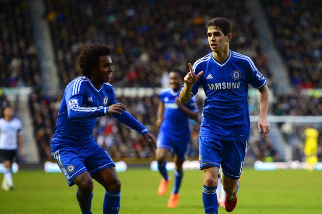 DERBY, ENGLAND - JANUARY 05:  Willian of Chelsea (L) congratulates Oscar of Chelsea on scoring their second goal during the Budweiser FA Cup Third Round match between Derby County and Chelsea at iPro Stadium on January 5, 2014 in Derby, England.  (Photo by Michael Regan/Getty Images)