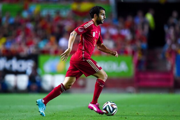 SEVILLE, SPAIN - MAY 30:  Cesc Fabregas of Spain runs with the ball during an international friendly match between Spain and Bolivia at Estadio Ramon Sanchez Pizjuan on May 30, 2014 in Seville, Spain.  (Photo by David Ramos/Getty Images)