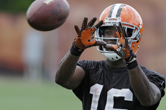Cleveland Browns wide receiver Andrew Hawkins catches balls after organized team activities at the NFL football team's facility in Berea, Ohio Tuesday, June 3, 2014. (AP Photo/Mark Duncan)