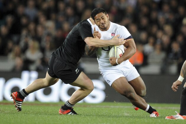 England’s Manu Tuilagi is tackled by New Zealand’s Dane Coles during the International Rugby Test at Eden Park in Auckland, New Zealand, Saturday, June 7, 2014. (AP Photo/SNPA, Ross Setford) NEW ZEALAND OUT