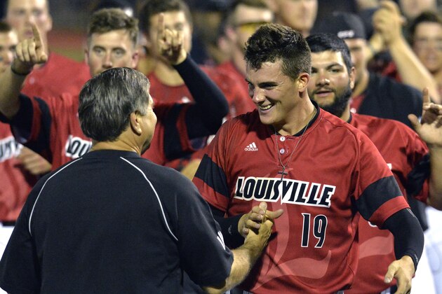 Louisville's Nick Burdi, right, is congratulated by Louisville athletic director Tom Jurich following the team's 7-4 victory over Kennesaw State in an NCAA college baseball tournament super regional game in Louisville, Ky., Saturday, June 7, 2014. (AP Photo/Timothy D. Easley) Louisville's Nick Burdi, right, is congratulated by Louisville athletic director Tom Jurich following the team's 7-4 victory over Kennesaw State in an NCAA college baseball tournament super regional game in Louisville, Ky., Saturday, June 7, 2014. (AP Photo/Timothy D. Easley)