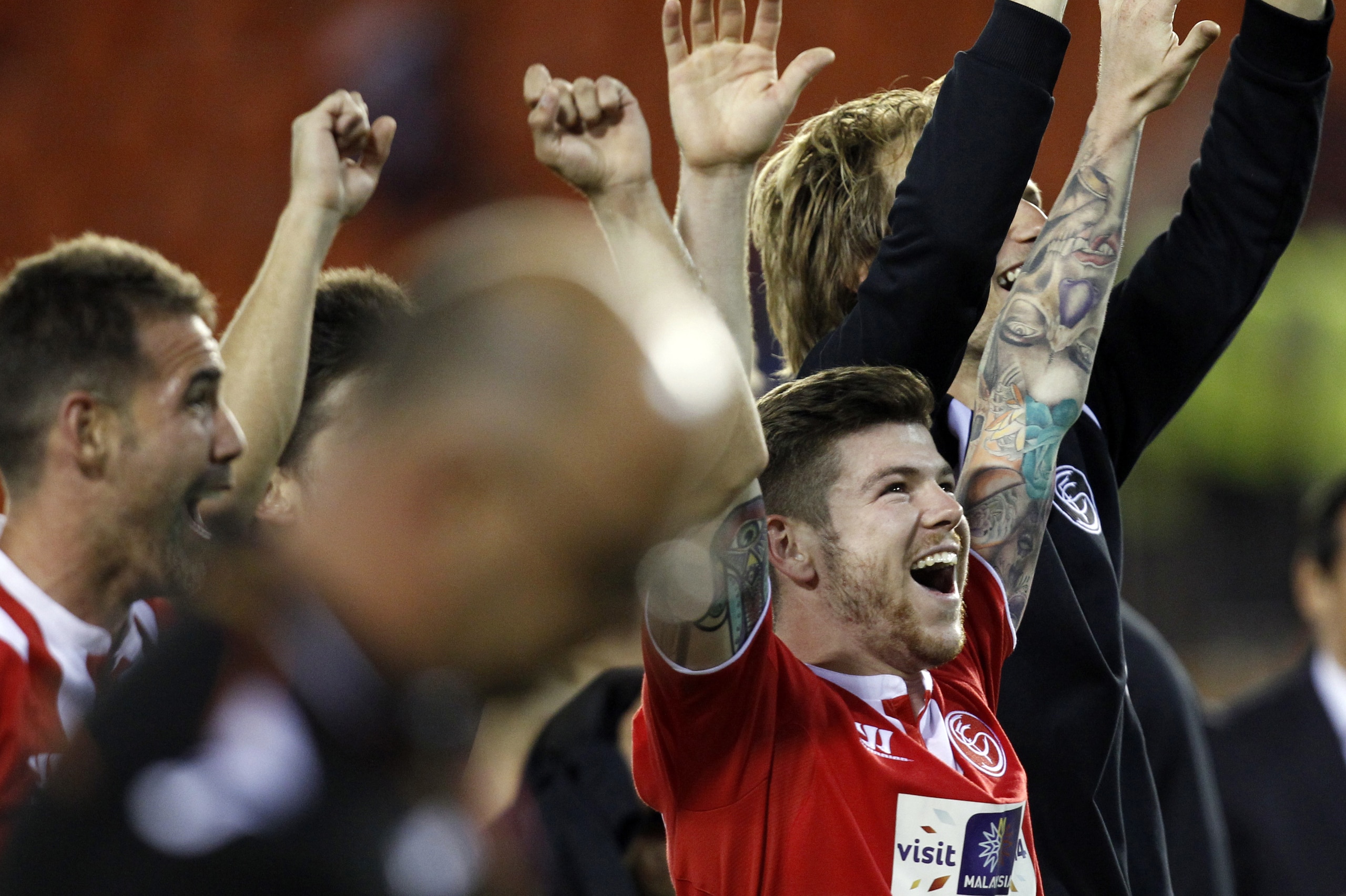 Sevilla's Alberto Moreno celebrates on the end their Europa League semifinal second leg soccer match against Valencia at the Mestalla stadium in Valencia, Spain, Thursday, May 1, 2014. Valencia lost 2-0 in the first leg at Sevilla. The game ended 3-1. Sevilla qualified for the final Europa League. (AP Photo/Alberto Saiz) Sevilla's Alberto Moreno celebrates on the end their Europa League semifinal second leg soccer match against Valencia at the Mestalla stadium in Valencia, Spain, Thursday, May 1, 2014. Valencia lost 2-0 in the first leg at Sevilla. The game ended 3-1. Sevilla qualified for the final Europa League. (AP Photo/Alberto Saiz)