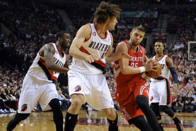Houston Rockets' Chandler Parsons (25) drives to the basket against Portland Trail Blazers' Robin Lopez (42) during the first half of game six of an NBA basketball first-round playoff series game in Portland, Ore., Friday May 2, 2014. (AP Photo/Greg Wahl-Stephens)