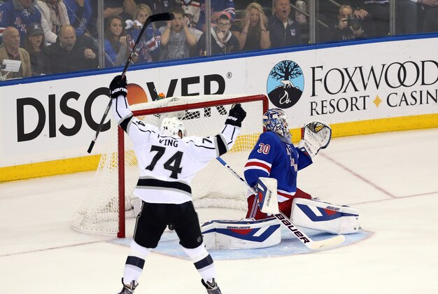 Jun 9, 2014; New York, NY, USA; Los Angeles Kings left wing Dwight King (74) celebrates after a goal is scored by center Jeff Carter (not pictured) past New York Rangers goalie Henrik Lundqvist (30) during the first period in game three of the 2014 Stanley Cup Final at Madison Square Garden. Mandatory Credit: Adam Hunger-USA TODAY Sports