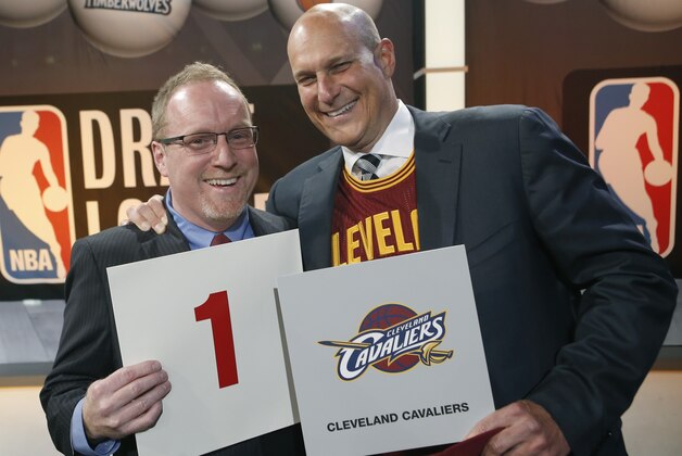 Cleveland Cavaliers general manager David Griffin, left, and minority owner Jeff Cohen celebrate after the Cavaliers won the top pick in the the NBA basketball draft lottery in New York, Tuesday, May 20, 2014. It's the third time in four years the Cavs will be atop the draft after moving up from the ninth spot. (AP Photo/Kathy Willens)