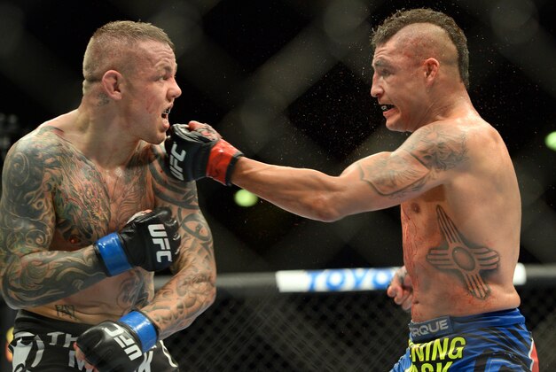 Jun 7, 2014; Albuquerque, NM, USA; Diego Sanchez (red) and Ross Pearson (blue) fight during their lightweight bout during UFC Fight Night 42 at Tingley Coliseum. Sanchez won via split decision. Mandatory Credit: Joe Camporeale-USA TODAY Sports