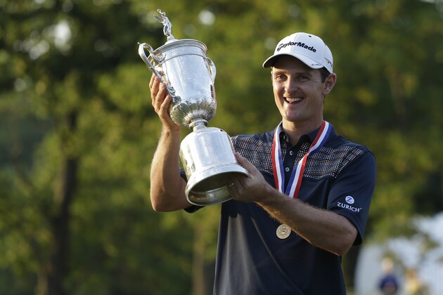 Justin Rose, of England, holds his trophy after winning the U.S. Open golf tournament at Merion Golf Club, Sunday, June 16, 2013, in Ardmore, Pa. (AP Photo/Darron Cummings)