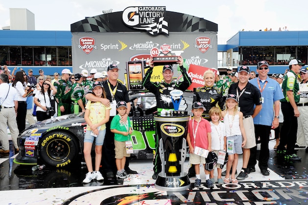 BROOKLYN, MI - JUNE 17:  Dale Earnhardt Jr., driver of the #88 Diet Mountain Dew/TheDarkKnightRises/National Guard/ Chevrolet, celebrates in Victory Lane after winning the NASCAR Sprint Cup Series Quicken Loans 400 at Michigan International Speedway on June 17, 2012 in Brooklyn, Michigan.  (Photo by John Harrelson/Getty Images for NASCAR)