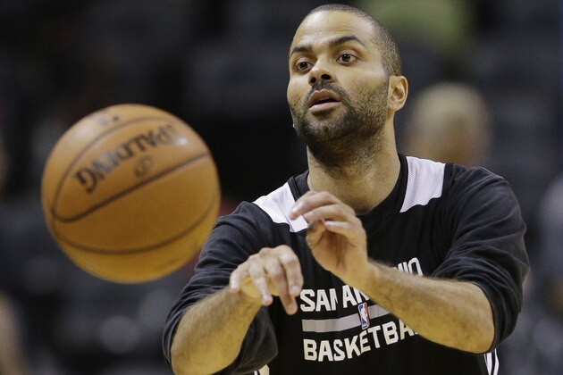 San Antonio Spurs guard Tony Parker passes the ball during basketball practice on Wednesday, June 4, 2014 in San Antonio. The Spurs play Game 1 of the NBA Finals against the Miami Heat on Thursday. (AP Photo/Eric Gay)