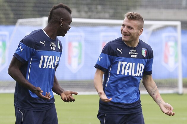 Italy's Mario Balotelli, left, talks with his teammate forward Ciro Immobile during a training session, in Mangaratiba, Brazil, Tuesday, June 10, 2014. Italy will play in group D of the Brazil 2014 soccer World Cup. (AP Photo/Antonio Calanni)