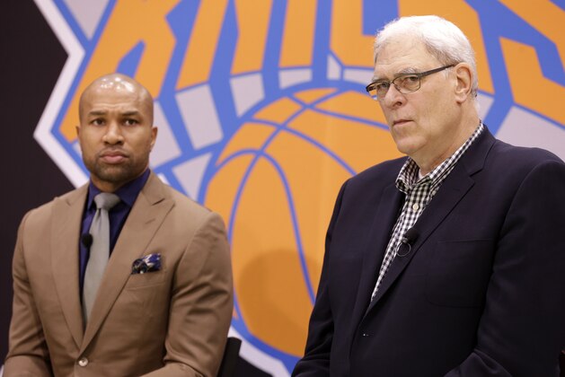 New York Knicks president Phil Jackson, right, and Derek Fisher participate in a news conference in Tarrytown, N.Y., Tuesday, June 10, 2014. The New York Knicks hired Fisher as their new coach on Tuesday, with Jackson turning to one of his trustiest former players. (AP Photo/Seth Wenig)