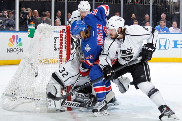 NEW YORK, NY - JUNE 09:  Carl Hagelin #62 of the New York Rangers attempts to jam the puck past Jonathan Quick #32 of the Los Angeles Kings near the net during Game Three of the 2014 NHL Stanley Cup Final at Madison Square Garden on June 9, 2014 in New York City. (Photo by Scott Levy/NHLI via Getty Images)