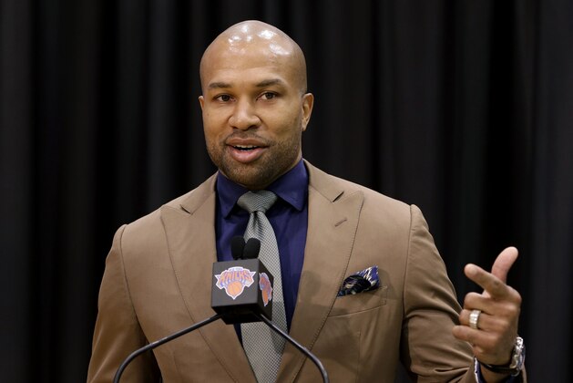 Derek Fisher speaks during a news conference in Tarrytown, N.Y., Tuesday, June 10, 2014. The New York Knicks hired Fisher as their new coach on Tuesday, with team president Phil Jackson turning to one of his trustiest former players. (AP Photo/Seth Wenig)