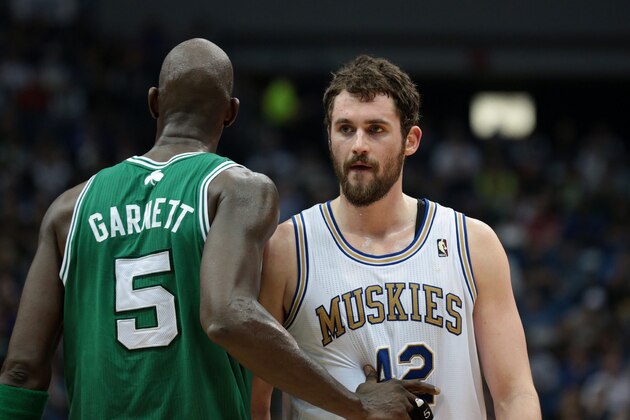 MINNEAPOLIS, MN - MARCH 30:  Kevin Garnett #5 of the Boston Celtics grabs Kevin Love #42 of the Minnesota Timberwolves during the game on March 30, 2012 at Target Center in Minneapolis, Minnesota. NOTE TO USER: User expressly acknowledges and agrees that, by downloading and or using this Photograph, user is consenting to the terms and conditions of the Getty Images License Agreement. Mandatory Copyright Notice: Copyright 2012 NBAE (Photo by Jordan Johnson/NBAE via Getty Images)