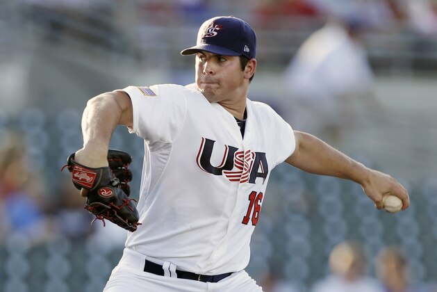 United States pitcher Carlos Rodon throws during the first inning of an exhibition game against Cuba, Thursday, July 18, 2013, in Des Moines, Iowa. (AP Photo/Charlie Neibergall)