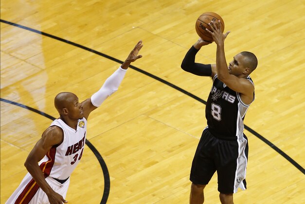 Jun 10, 2014; Miami, FL, USA; San Antonio Spurs guard Patty Mills (8) shoots while defended by Miami Heat guard Ray Allen (34) during the third quarter of game three of the 2014 NBA Finals at American Airlines Arena. Mandatory Credit: Robert Mayer-USA TODAY Sports