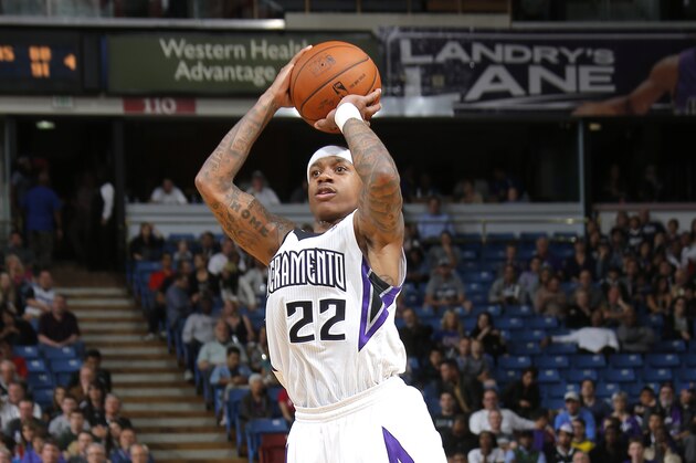 SACRAMENTO, CA - MARCH 21: Isaiah Thomas #22 of the Sacramento Kings shoots a three pointer against the San Antonio Spurs on March 21, 2014 at Sleep Train Arena in Sacramento, California. NOTE TO USER: User expressly acknowledges and agrees that, by downloading and or using this photograph, User is consenting to the terms and conditions of the Getty Images Agreement. Mandatory Copyright Notice: Copyright 2014 NBAE (Photo by Rocky Widner/NBAE via Getty Images)