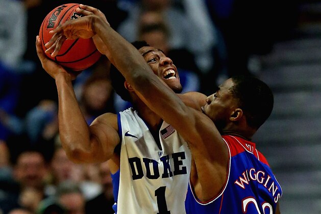 CHICAGO, IL - NOVEMBER 12: Jabari Parker #1 of the Duke Blue Devils tries to shoot against Andrew Wiggins #22 of the Kansas Jayhawks during the State Farm Champions Classic at the United Center on November 12, 2013 in Chicago, Illinois. Kansas defeated Duke 94-83.  (Photo by Jonathan Daniel/Getty Images)
