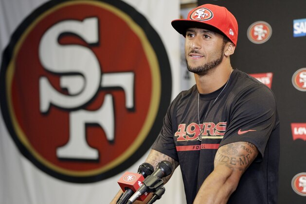 San Francisco 49ers quarterback Colin Kaepernick answers question during an NFL football press conference on Wednesday, June 4, 2014, in Santa Clara, Calif. Kaepernick received a new six-year contract extension Wednesday that keeps him with the franchise through the 2020 season. (AP Photo/Marcio Jose Sanchez)
