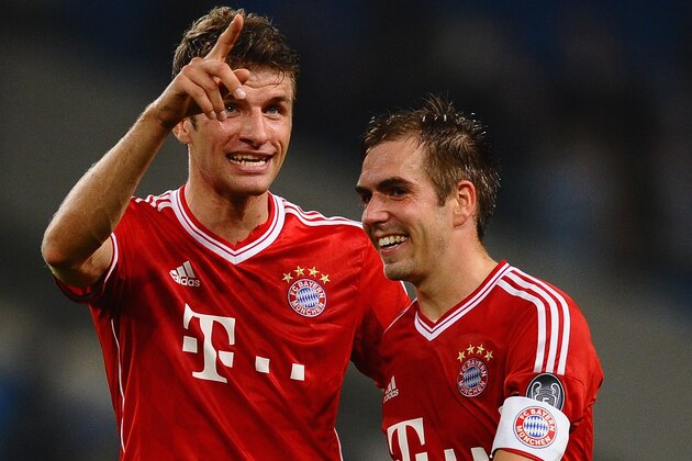 MANCHESTER, ENGLAND - OCTOBER 02:  Thomas Muller and Philipp Lahm of FC Bayern Muenchen celebrates during the UEFA Champions League Group D match between Manchester City and  FC Bayern Muenchen at Etihad Stadium on October 2, 2013 in Manchester, England.  (Photo by Laurence Griffiths/Getty Images)