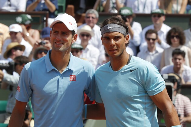 Serbia's Novak Djokovic, left, and Spain's Rafael Nadal, right, pose for photographers prior to the final of the French Open tennis tournament at the Roland Garros stadium, in Paris, France, Sunday, June 8, 2014.  (AP Photo/Michel Euler)