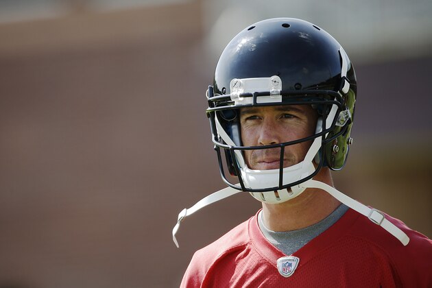Atlanta Falcons quarterback Matt Ryan walks on the field during an NFL football organized team activity, Wednesday, June 4, 2014, in Flowery Branch, Ga. (AP Photo/David Goldman)
