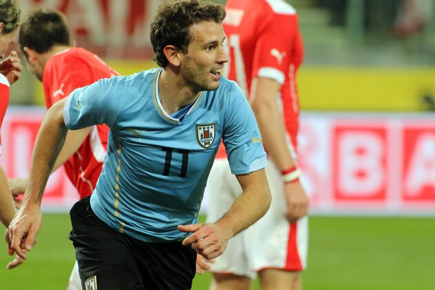 Uruguay's Christhian Stuani  celebrates after scoring during a friendly soccer match between Austria and Uruguay, in Klagenfurt,  Austria Wednesday, March 5, 2014. (AP Photo/Ronald Zak)