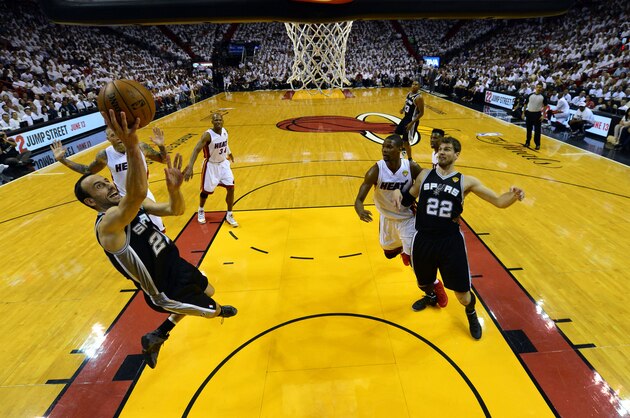 San Antonio Spurs guard Manu Ginobili (20) goes to the basket against the Miami Heat in the first half in Game 3 of the NBA basketball finals in Miami, Tuesday, June 10, 2014. (AP Photo/Steve Mitchell, Pool)