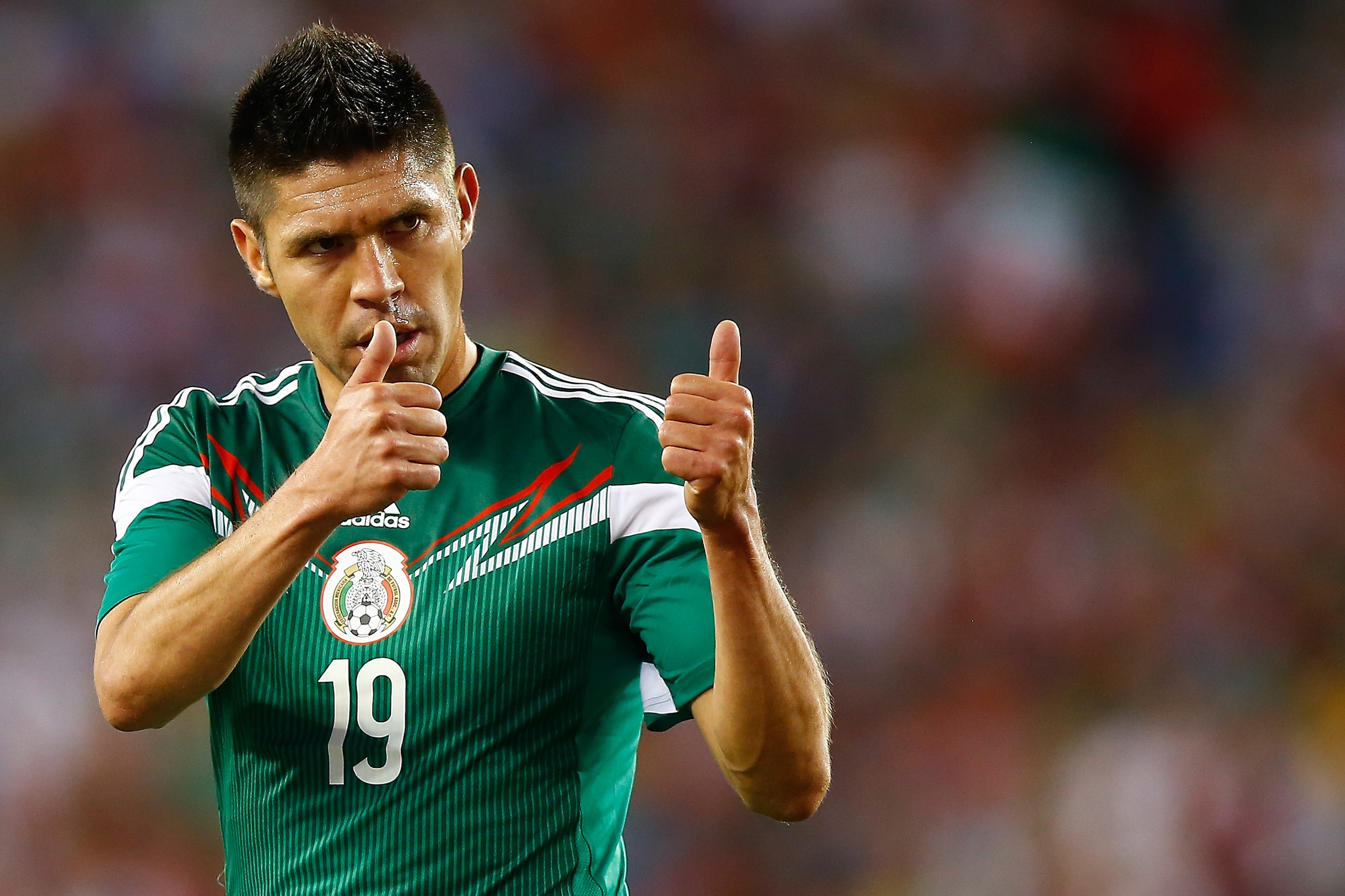 FOXBORO, MA - JUNE 06: Oribe Peralta #19 of Mexico reacts to a teammate during a corner kick against Portugal in the second half during the international friendly match at Gillette Stadium on June 6, 2014 in Foxboro, Massachusetts.  (Photo by Jared Wickerham/Getty Images)