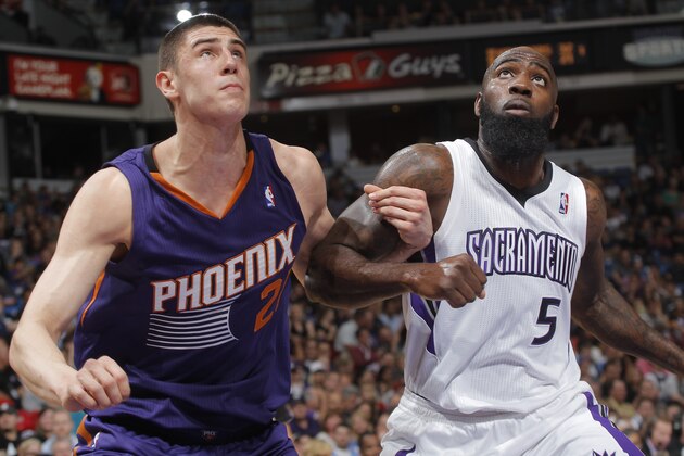SACRAMENTO, CA - APRIL 16: Alex Len #21 of the Phoenix Suns battles Quincy Acy #5 of the Sacramento Kings on April16, 2014 at Sleep Train Arena in Sacramento, California. NOTE TO USER: User expressly acknowledges and agrees that, by downloading and or using this photograph, User is consenting to the terms and conditions of the Getty Images Agreement. Mandatory Copyright Notice: Copyright 2014 NBAE (Photo by Rocky Widner/NBAE via Getty Images)